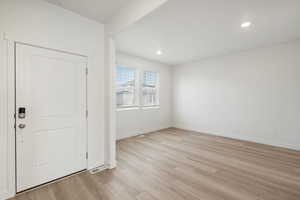 **DISCALIMER** Interior options may vary.Foyer featuring light wood-style floors and recessed lighting