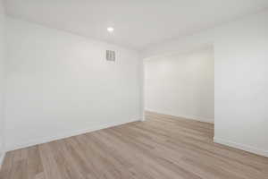 **DISCALIMER** Interior options may vary.Empty room featuring light wood-type flooring and recessed lighting