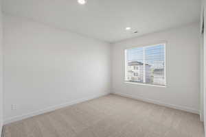 **DISCALIMER** Interior options may vary.Empty room with light carpet and recessed lighting