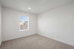 **DISCALIMER** Interior options may vary.Carpeted empty room with baseboards and recessed lighting