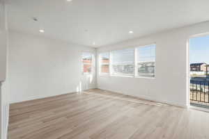 **DISCALIMER** Interior options may vary.Empty room featuring light wood-style flooring and recessed lighting