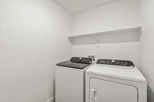 Laundry area featuring washer and clothes dryer