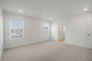 **DISCALIMER** Interior options may vary.Unfurnished room featuring light colored carpet and recessed lighting