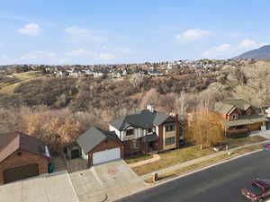 Aerial view of residential area featuring a mountainous background