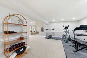 Workout room with arched walkways and recessed lighting