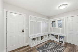 Mudroom with dark wood-style floors