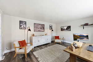 Office space featuring wood finished floors and baseboards