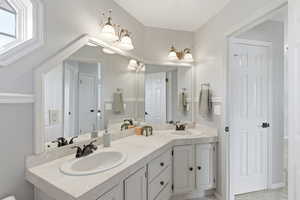 Full bathroom with double vanity