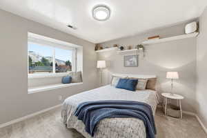 Carpeted bedroom with baseboards and a mountain view