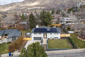Aerial view of residential area featuring a mountain backdrop