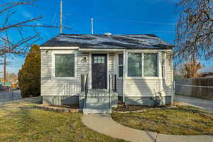 View of front facade featuring a shingled roof