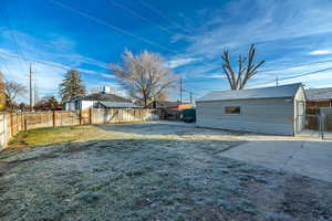 Fenced backyard with a patio and a gate