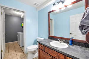 Bathroom with vanity and light tile patterned flooring