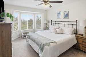 Bedroom with carpet flooring and ceiling fan