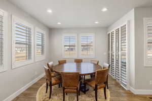 Dining room featuring plenty of natural light, light wood-style flooring, and recessed lighting
