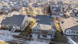Snowy aerial view with a residential view