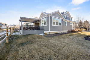 View of property exterior featuring board and batten siding and a deck