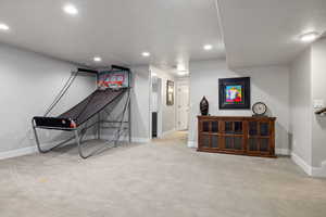 Game room featuring light colored carpet and recessed lighting