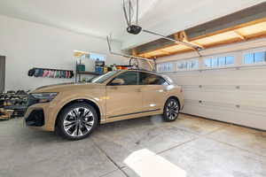 Garage featuring a garage door opener
