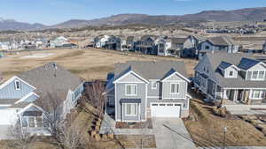 Aerial perspective of suburban area featuring a mountain backdrop