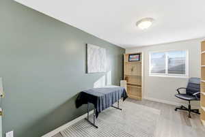 Office area with light wood finished floors and baseboards