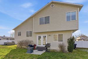 Back of house with french doors, a patio, and entry steps
