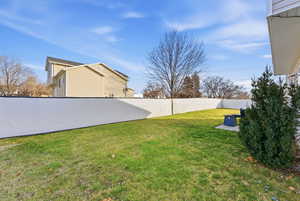 Fenced backyard with a patio