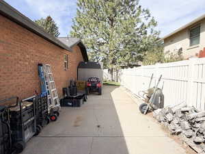 View of patio featuring an outdoor structure