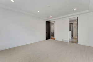 Unfurnished bedroom with recessed lighting and light colored carpet