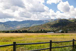 View of mountain background featuring rural landscape