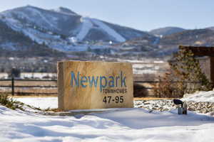 Community sign featuring a mountain view