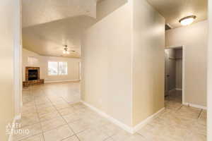 Hall featuring light tile patterned flooring