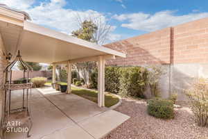 Fenced backyard featuring a patio