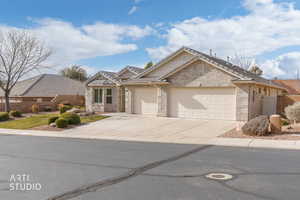 Single story home with concrete driveway, an attached garage, and brick siding