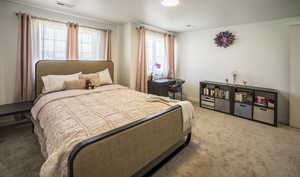 Carpeted bedroom with baseboards