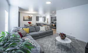 Living area with a chandelier and recessed lighting