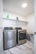 Laundry area featuring washer and clothes dryer