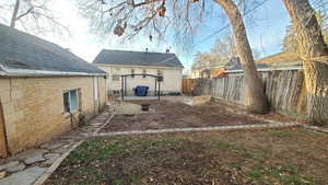 Fenced backyard with a patio area