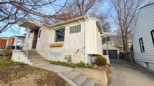 View of front of property with a detached garage