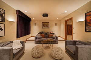 Home theater room with recessed lighting