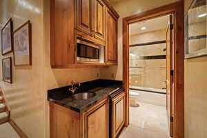 Kitchen with stainless steel microwave and wood finish cabinets