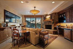 Living room with light carpet and recessed lighting