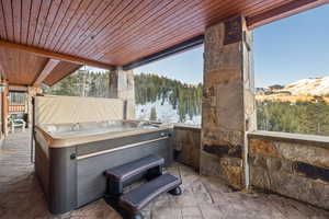 View of patio / terrace featuring a hot tub