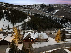 Snowy aerial view featuring a mountain view