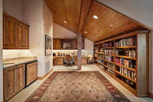 Office featuring vaulted ceiling with beams, built in desk, recessed lighting, and wooden ceiling