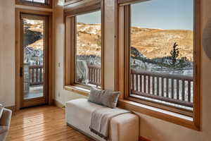 Living area with a mountain view and hardwood / wood-style floors