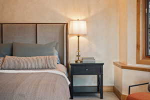 Carpeted bedroom featuring baseboards