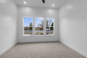 Unfurnished room featuring light carpet, recessed lighting, and a ceiling fan