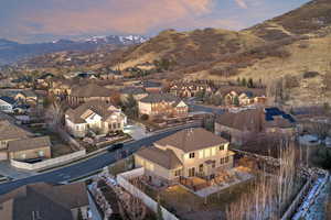 Aerial perspective of suburban area featuring a mountainous background