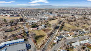 Aerial view of property's location with a mountainous background